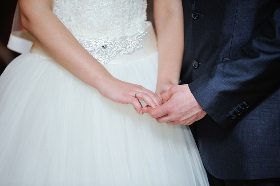 bride and groom holding hands